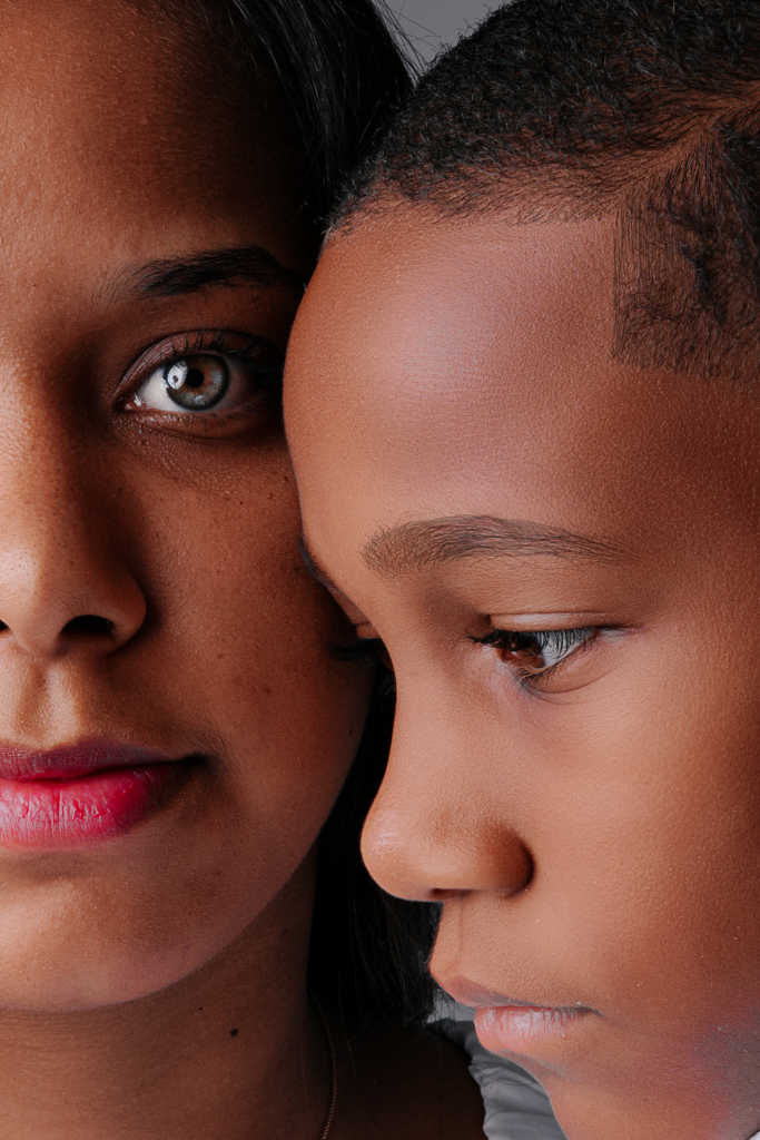 How Parents May Unintentionally Slow Down Therapy Progress (Insights from SensoryCare Therapy Services) Intimate close-up of a mother and son sharing a serious moment, captured in a studio setting.