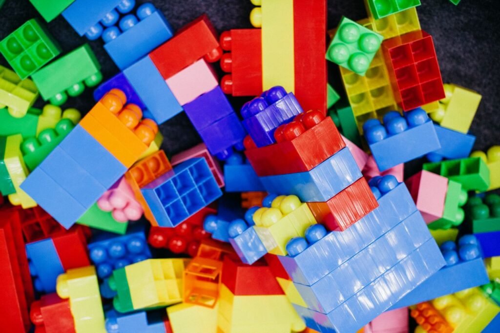 Brightly colored plastic building blocks arranged in a playful pattern, perfect for children